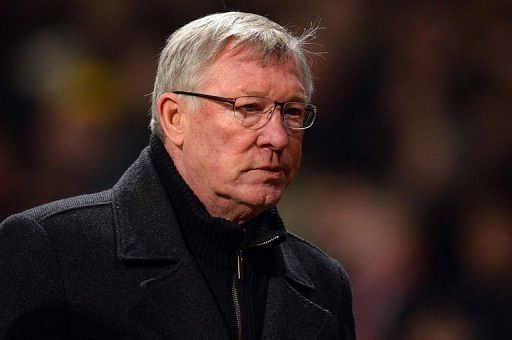 United manager Alex Ferguson leaves the field at half time in Manchester on March 5, 2013
